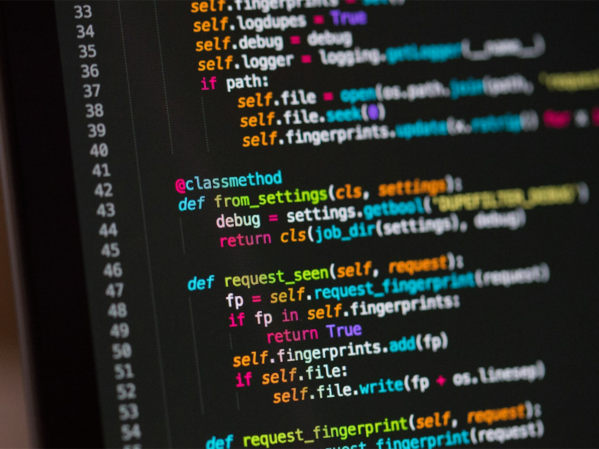 Laptop and tablet displaying custom software interfaces
